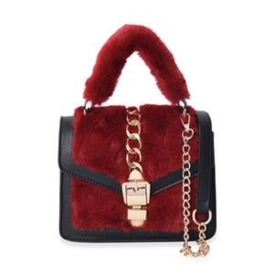 Red and black buckle accent shoulder bag